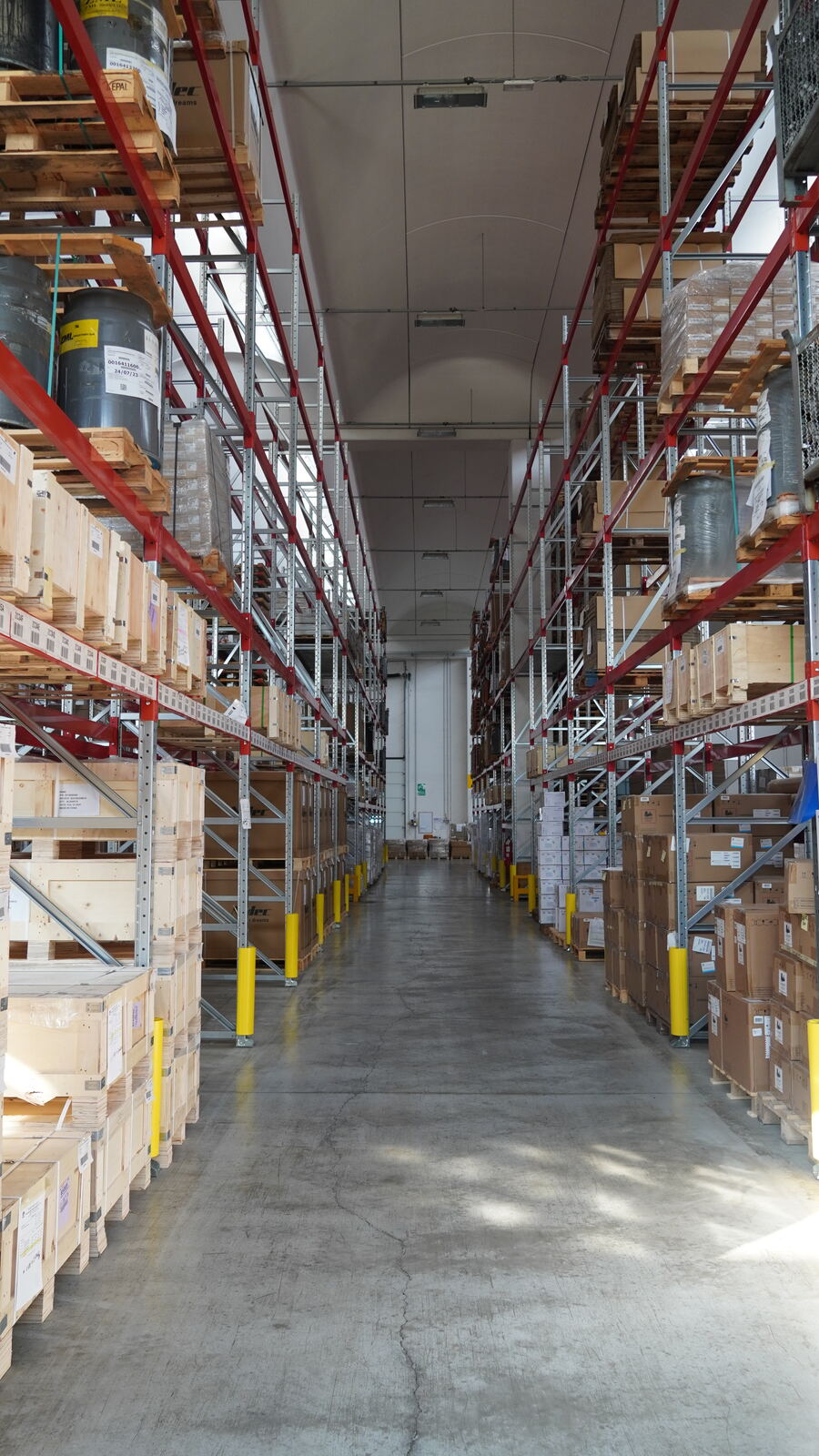 Aisle in the CLD warehouse between racks of palletised goods